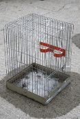 A metal framed bird cage.