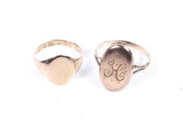 An early 20th century 9ct oval signet ring and a yellow metal signet ring.