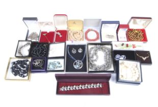 An assortment of boxed costume jewellery.