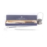 A Mappin and Webb carving set and two large meat skewers.