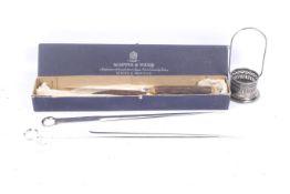 A Mappin and Webb carving set and two large meat skewers.