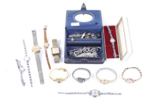 An assortment of mostly ladies wrist and bracelet watches and other items.