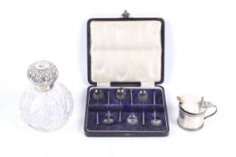 A silver mounted clear cut glass spherical scent bottle and other items.
