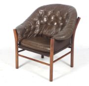 A Gunnar Kentemo (Swedish) 'Pedro' brown leather button back armchair.
