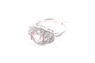 A modern 9ct white gold morganite and diamond dress ring. Hallmarks for Birmingham 2009, size N, 4.