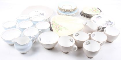 Two 20th century tea services and a set of Carlton Ware plates.