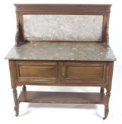 An Edwardian marble topped mahogany wash stand.