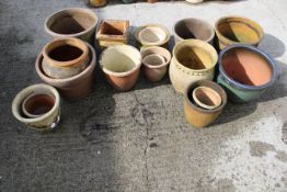 A collection of nineteen assorted garden pots. Mostly circular in form, one square, etc. Max.