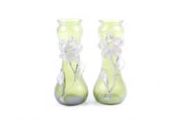 A pair of Art Nouveau style bottle green glass gourd shaped vases.