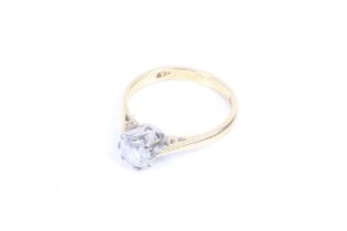 An 18ct gold and diamond solitaire ring. The round brilliant cut stone approx. 0.