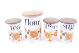 A set of four Fielding & Co Crown Devon kitchen storage jars.