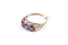 A 9ct gold and oval amethyst three stone ring. London, size O, 2.