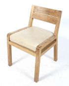 A mid-century wooden framed chair.