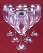 A set of six large Italian wine glasses. With silvered rims and engraved decoration, H25.