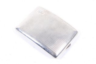 A George V silver engine turned concave-oblong cigarette case.