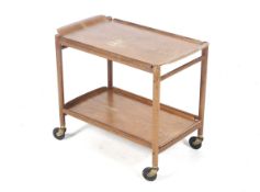 A 1950s designer bentwood drinks trolley.