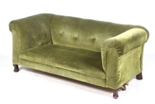 An Edwardian green velvet drop end sofa.