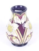 A Moorcroft White Christmas Rose vase. Design by Kerry Goodwin, 2011, H9.5cm.