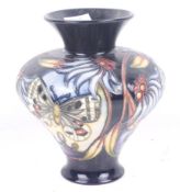 A Moorcroft Apollo pattern vase by Sian Leeper. Dated 2005. H15cm. (AF).