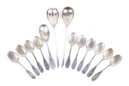 A set of German .800 standard silver ice cream spoons and a serving spoon.