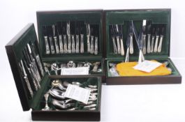 Three canteens of silver plated cutlery.