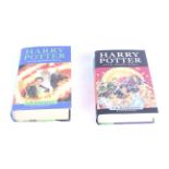 Two first edition Harry Potter books.