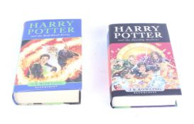Two first edition Harry Potter books.