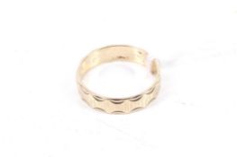 A vintage 9ct gold broad wedding band.