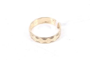 A vintage 9ct gold broad wedding band.