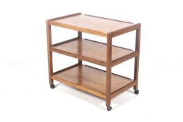 A mid-century Ernst Gomme G-Plan wooden tea trolley. The three shelf model on casters.