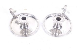 A pair of Garrard silver plated chambersticks.