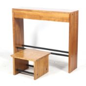 A contemporary hardwood console table and matching side table.