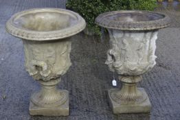 A pair of classical garden pedestal urns.