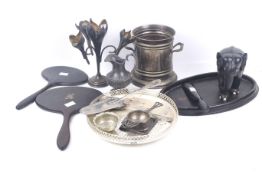 A small collection of silver plate, ebony and other items.