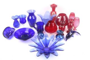An assortment of Victorian and later blue and red glassware.