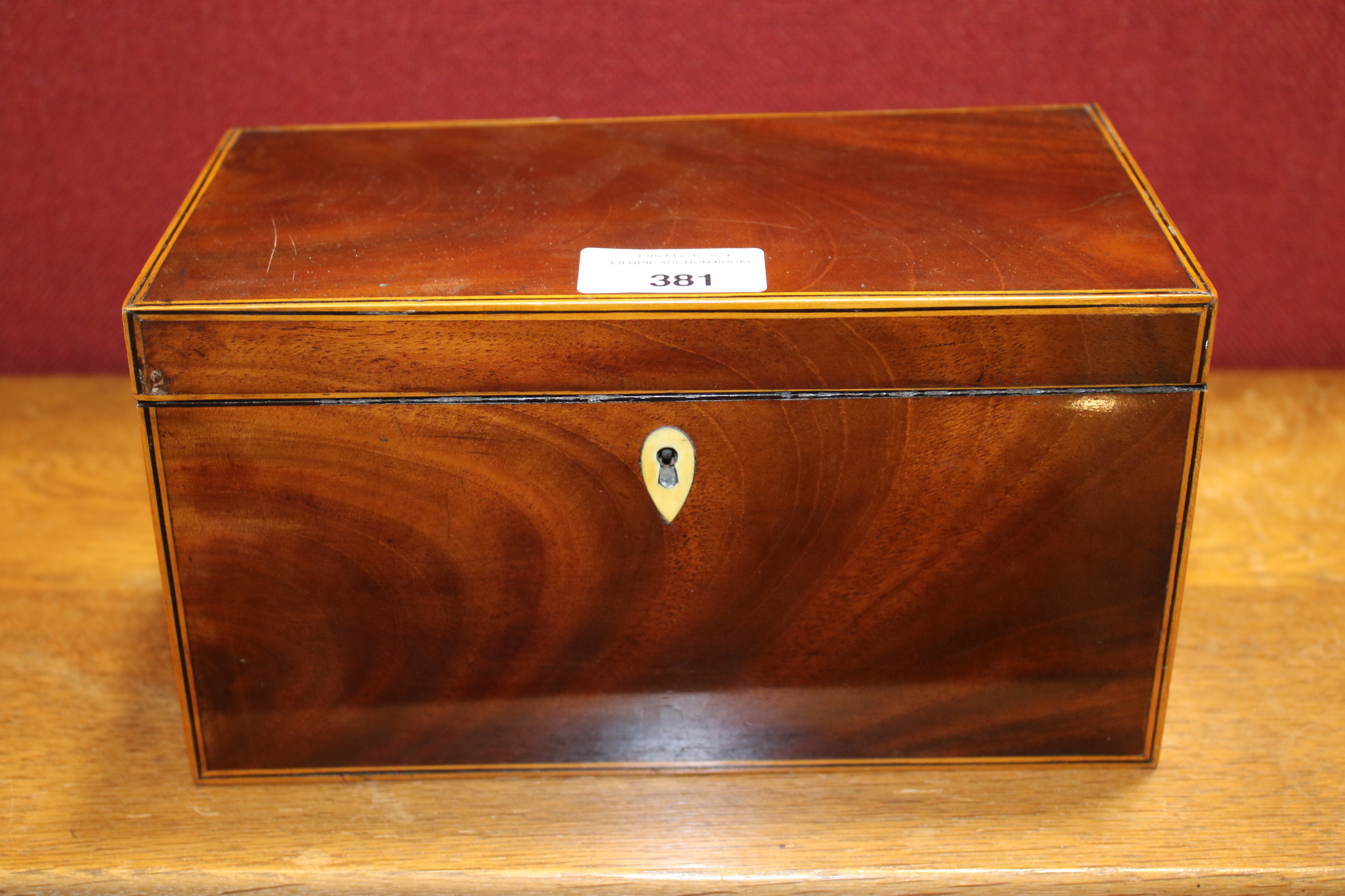 A 19th century mahogany veneered tea caddy. - Image 4 of 10