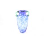 A hand blown mottled blue glass baluster vase with green handles. H31.
