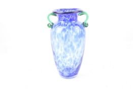 A hand blown mottled blue glass baluster vase with green handles. H31.