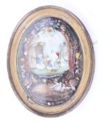 A Victorian gilt framed oval collage picture.