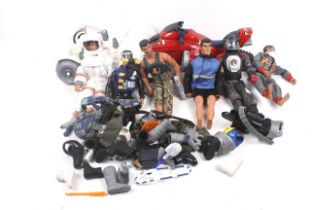 An assortment of Hasbro Action Man figures and accessories. Including vehicles, clothes, etc.