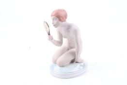 A Royal Copenhagen Gerhard Henning porcelain figure.