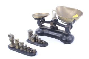 A set of Libra kitchen balance scales with two sets of weights.