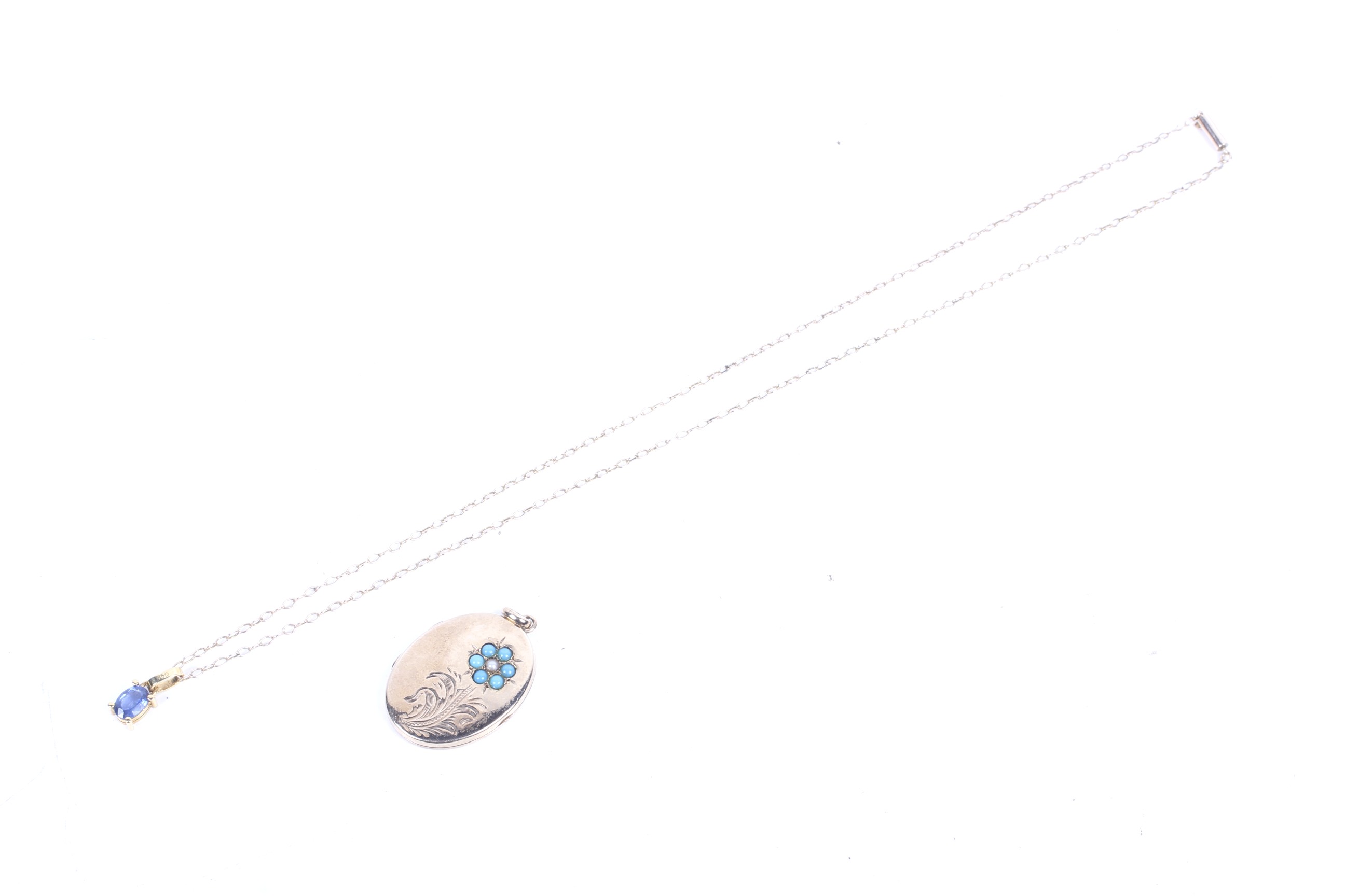 A modern oval sapphire single stone pendant and chain and an oval locket.