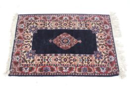 A Persian style wool rug.