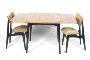 Circa 1950s E Gomme G-Plan Librenza Tola drop leaf table and two 'Butterfly' chairs.