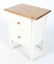 A contemporary wooden bedside cabinet.