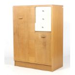 A mid-century E Gomme G-Plan (EG gold stamp) oak tall boy wardrobe.