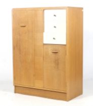 A mid-century E Gomme G-Plan (EG gold stamp) oak tall boy wardrobe.