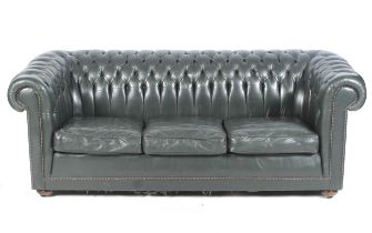 A contemporary dark green leather Chesterfield button back three-seater sofa.
