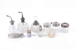 A collection of silver mounted glass vanity items.